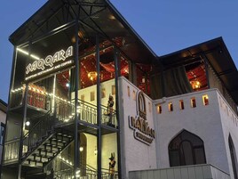 A hotel with a modern design, featuring a restaurant named Saqqara Egyptian Restaurant and Coffee.