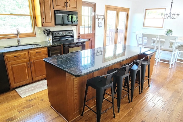 Fully furnished kitchen with seating for 10.