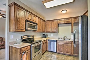 Enjoy cooking in this well-equipped kitchen with an oven, microwave, and refrigerator.