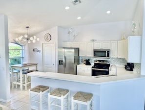 Kitchen stocked with appliances and cookware for your enjoyment