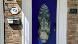A blue door with a decorative glass panel, a mailbox with the number 1336, and a mailbox with the number 1331. - Elegant, large 2 bedroom main floor apartment (Toronto)