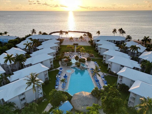 Outdoor pool - Sunset Cove 2BR/2BA • Ocean Views • Pool/ Swim-Up Bar • Hot Tub • Walk to Beach! (George Town)