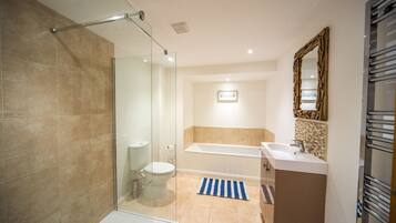 Bathtub, hair dryer, towels, soap