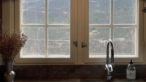 A kitchen with a window, a faucet, and a bottle of hand soap. - Beautiful home in Uvdal with kitchen (Uvdal)