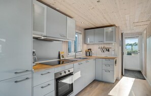 Fridge, stovetop, dishwasher, coffee/tea maker