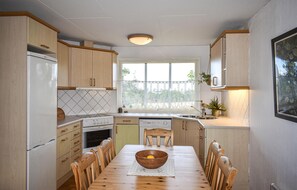 Fridge, stovetop, dishwasher, coffee/tea maker
