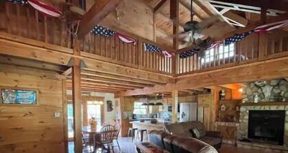 Real Log Cabin with Seasonal Pool and Hot Tub near Blue Springs Ranch