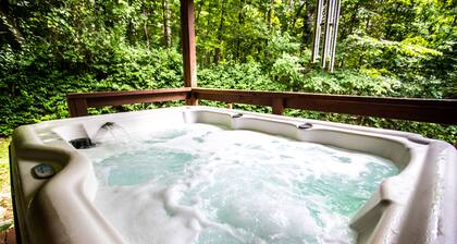 Honeysuckle Hideaway<br>Cabin with hot tub and king bed! Family friendly.