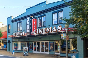 A building with a sign reading "ROYAL CINEMAS" and "PARKING" indicating a cinema and parking facility.
