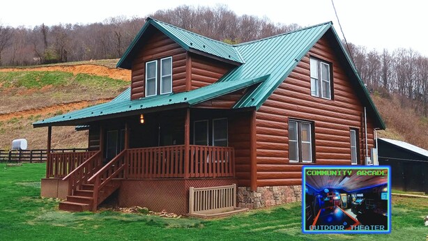 A wooden log cabin with a porch and stairs leading to a front door.