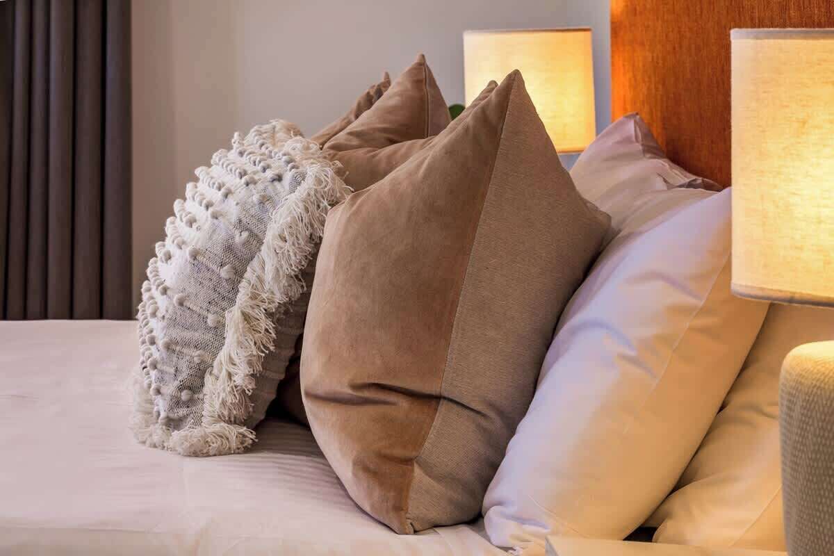 Styled interior with cushions and lamps