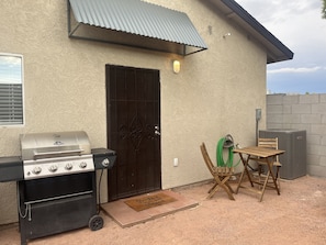 Enjoy al fresco dining on the patio, where a grill and seating area await.