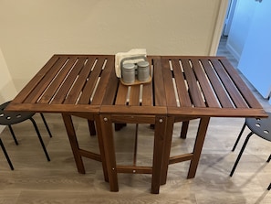 Enjoy meals in this dining area with a central support table and four legs.