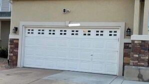A two-story house with a garage, a driveway, and a small lawn area. - 3 bedroom house 5 minutes away from the airport in Colorado Springs all for you. (Colorado Springs)