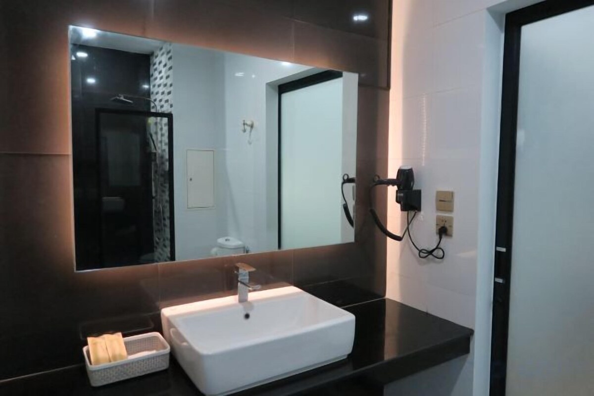 Bathroom | Shower, rainfall showerhead, hair dryer, towels