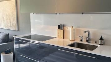 Comfort Apartment | Private kitchen | Full-size fridge, oven, stovetop, dishwasher