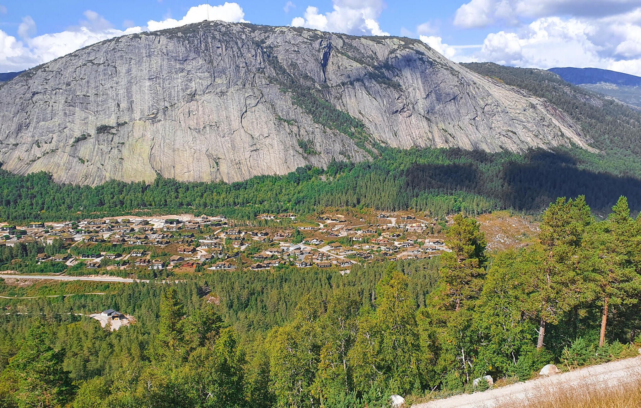 A mountainous landscape with a small town nestled in the valley.