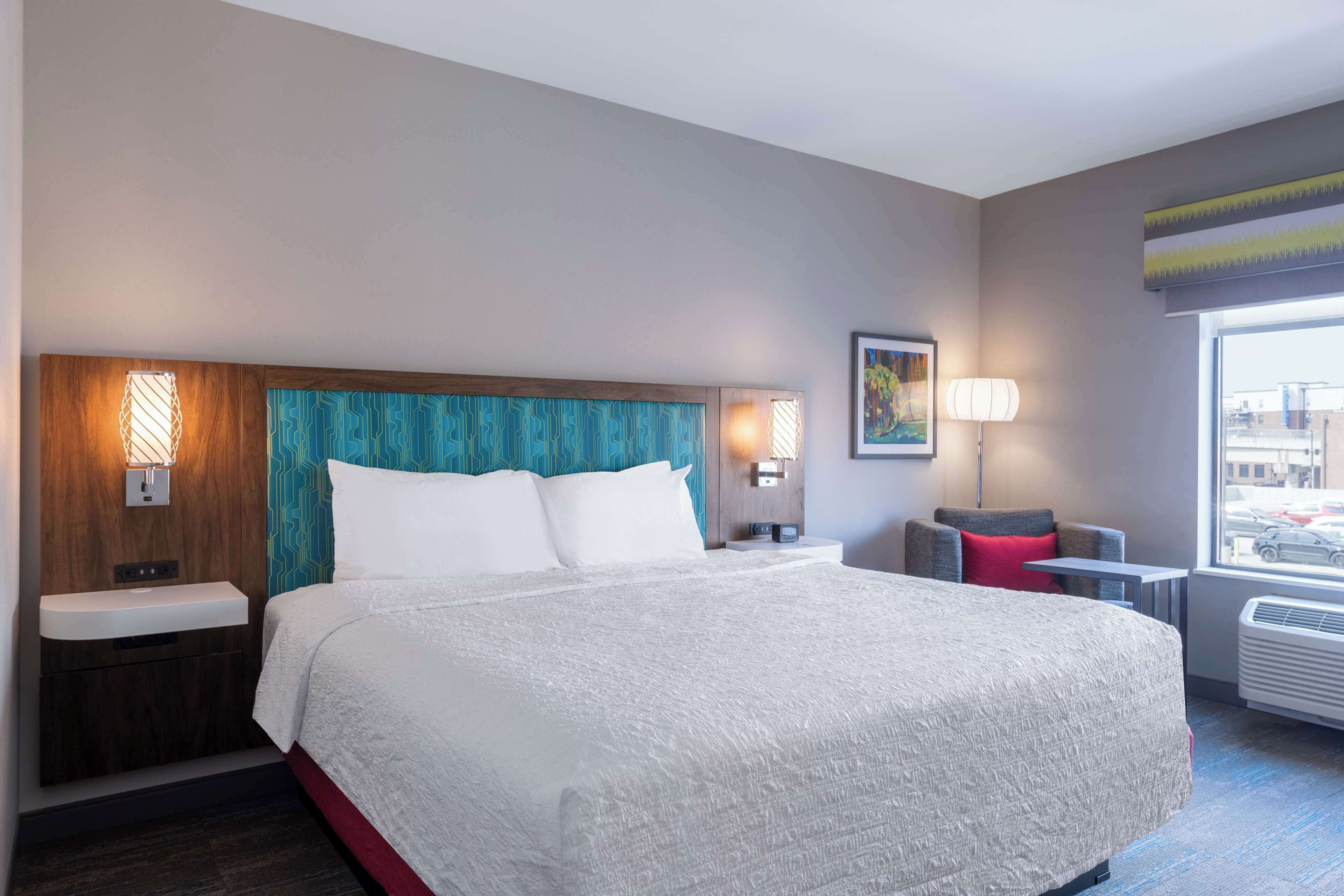 Hypo-allergenic bedding, desk, laptop workspace, blackout curtains