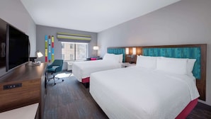 A hotel room with two beds, a desk, a TV, and a window with a view. - Hampton Inn Columbus Downtown, GA (Columbus)
