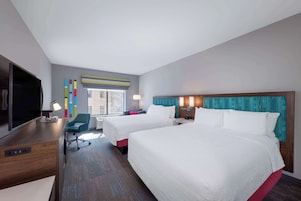 Hypo-allergenic bedding, desk, laptop workspace, blackout curtains