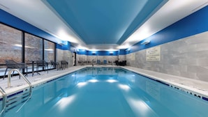 An indoor swimming pool with clear signage, a tiled wall, and a blue ceiling. - Hampton Inn Columbus Downtown, GA (Columbus)