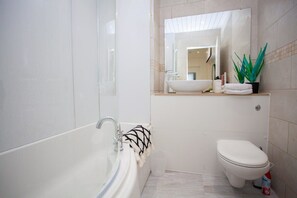Bathtub, hair dryer, towels