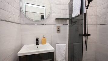 Shower, hair dryer, towels