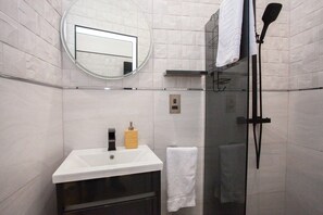 Shower, hair dryer, towels