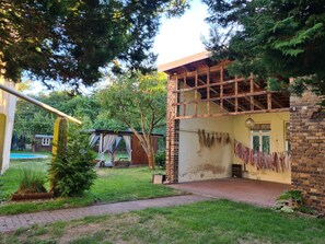 Experience a charming stay in this traditional home with a well-maintained garden and a balcony overlooking the surroundings.