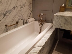 Bathtub, bidet, towels, soap