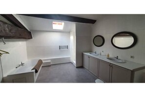 Bathtub, hair dryer, towels, soap
