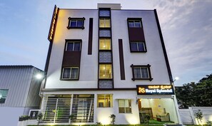A hotel with a modern facade, multiple windows, and a sign indicating it is the Royal Splendid. - Hotel Royal Splendid (Bengaluru)