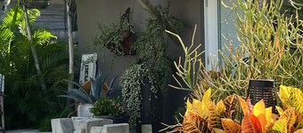 Chill on the patio overlooking the pool & lush gardens with privacy!