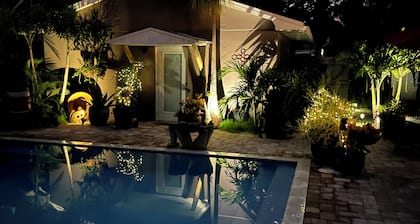 Chill on the patio overlooking the pool & lush gardens with privacy!