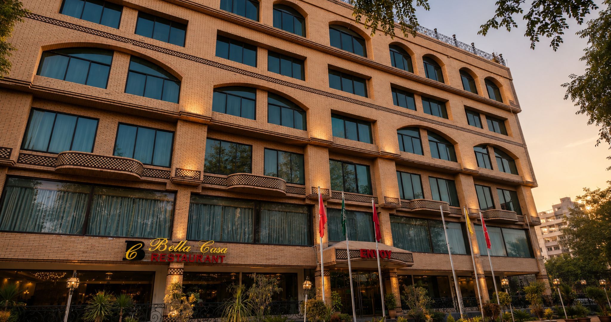 A multi-story hotel with a restaurant on the ground floor named 'Bella Casa Restaurant.'