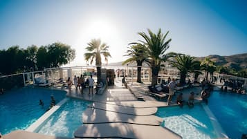 Seasonal outdoor pool, open 9:00 AM to 9:00 PM, pool loungers