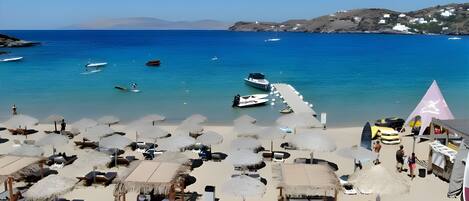 On the beach, beach cabanas, sun-loungers, beach volleyball