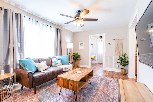 Smart TV, fireplace, books, offices