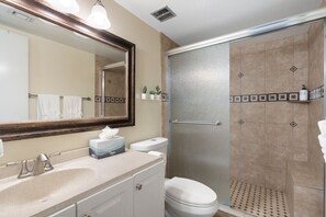 A bathroom with a sink, mirror, toilet, and shower. - Oasis Paradise in Arcadia | Pool+Hot Tub | Views! (Phoenix)