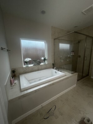 Combined shower/tub, jetted tub