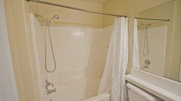 Combined shower/bathtub, hair dryer, towels, soap