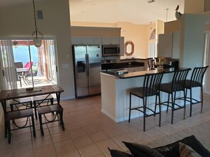 Fridge, microwave, oven, stovetop - Stunning Sandpiper Bay Home. Heated Pool and Spa. (Port St Lucie)