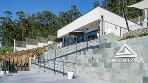 A modern building with a stone facade and a sign reading "Veiga da Fraga". - Veiga da Fraga, all the secrets of Galicia and the Rías Baixas (PONTEVEDDRA, POIO)