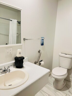 Combined shower/tub, towels, soap, shampoo