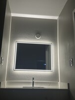 Separate tub and shower, rainfall showerhead, designer toiletries