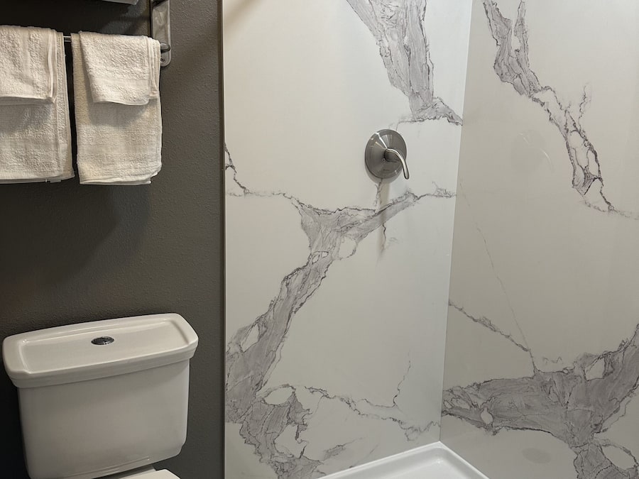 Separate tub and shower, rainfall showerhead, designer toiletries