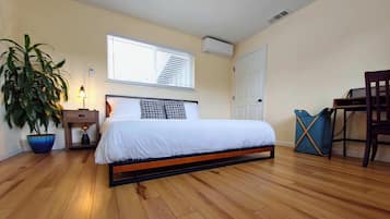 1 bedroom, desk, iron/ironing board, travel crib