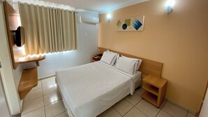 A hotel room with a bed, bedside tables, a wall-mounted TV, and a window with curtains. - DiRoma Fiori com um dia no Acqua park (Caldas Novas)