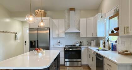 Beautiful home, walk into downtown, hot tub, dog friendly, Huge yard, fire pits.
