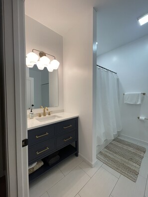 Bathtub, hair dryer, towels, soap